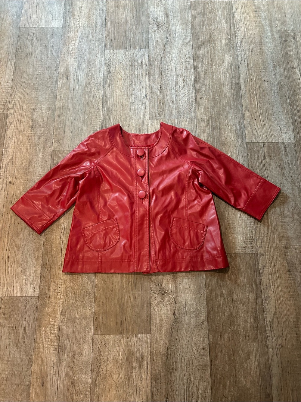 Red Faux Leather Jacket with Pockets and Button Front. Size: L